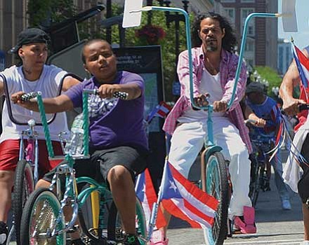 Cyclists with tricked-out low-rider bikes.