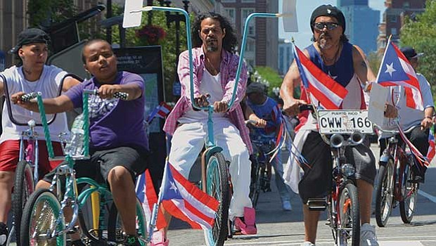 Cyclists with tricked-out low-rider bikes.