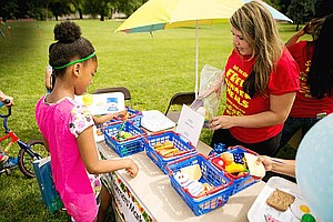The Illinois Hunger Coalition (IHC) along with State Representative Juliana Stratton is helping raise awareness of the summer meals program so more students receive summer meals when they normally would rely on breakfast or lunch during the school year. Photo Credit: The Illinois Hunger Coalition (IHC)