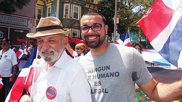 Suffolk County Register of Deeds Felix D. Arroyo and Ricardo Arroyo march in the parade.