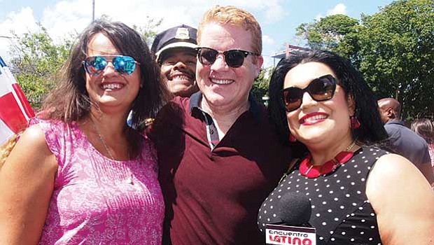 At-large City Councilor Anissa Essaibi-George, Police Chief William Gross (photobombing in rear),
and Centro host Yadires Nova-Salcedo enjoy a moment during the parade.