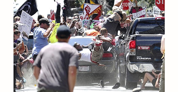 A car rammed into a crowd of protesters and a state police helicopter crashed into the woods Saturday as tension ... A car rammed into a crowd of protesters and a state police helicopter crashed into the woods Saturday as tension ...