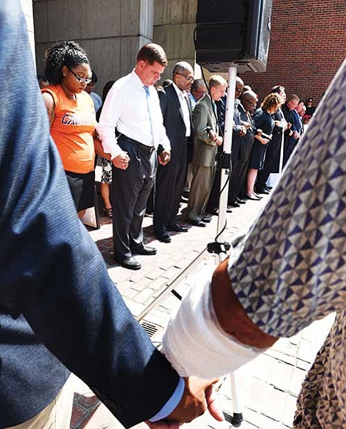 Elected officials and clergy join together in a prayer service on Boston City Hall Plaza prior to the Free Speech Rally held last Saturday.