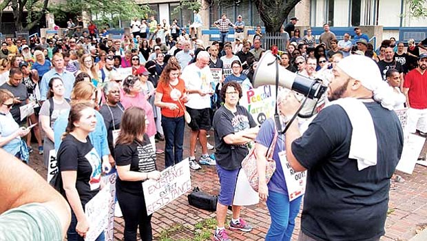 Demonstrators readying to march to the Boston Common gathered outside Roxbury’s Madison Park High School where they overflowed the plaza and filled Malcolm X Boulevard.