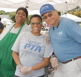 Lawnside New Jersey, Parent Teacher Association member, Gloria "Miss Sissy" Johnson and President, Debbie DeAbreu with Councilman for Lawnside Ron DeAbreu were serving free hot dogs and burgers to parents and students.