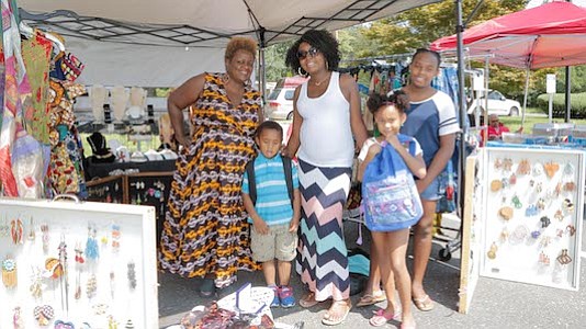 Felicia Mosley with her children ages 12, 6 and 3 visited the Sweet Pea Accessories with owner, Pamela Roberts.