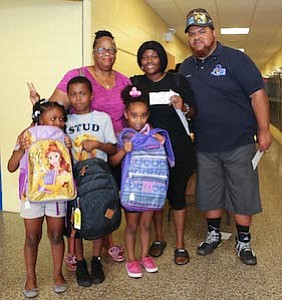 Val Smith, Ebony David and children (Lawnside Students) are pictured with Brother LaMar Bell of Hiram Lodge #5 F & AM, PHA Lawnside, NJ. Brothe LaMar Bell gave Ebony's son a $10 Hair Cut Voucher sponsored by the Hiram Lodge #5 F & AM, PHA Lawnside, NJ.