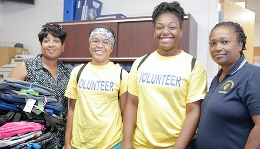 Lawnside School District Board Member, India Criss with former Lawnside student and current Haddon High School student volunteers Shapria Kelly and Cydney Thomas and Lawnside School District Boad President, Sabrina Forrest.