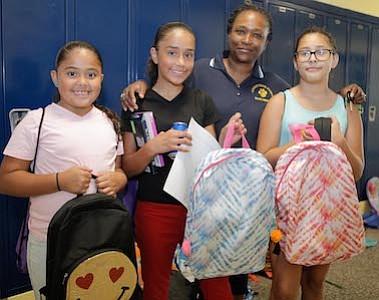Lawnside School District Boad President, Sabrina Forrest with members of the Perez and Ocasio Families.