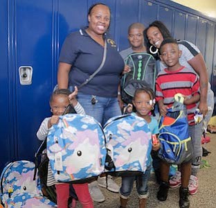 Lawnside School District Board Member, Marsharee Wright with members of the Berry family.