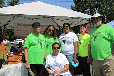 The Benson Multicultural History Museum booth with Ellen Benson, Bethany Benson King, Sydnee King, Tanya Benson Bailey, Walter King, and sitting on chair, Pamela Benson Phillips.