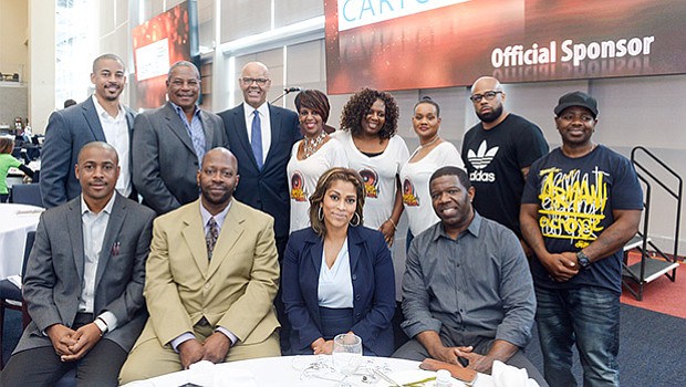 Members of The Bass Radio Station (WZBR, 1410AM) family sponsored the GNEMSDC luncheon. They pose here with Peter Hurst, President & CEO of the GNEMSDC (second row, third from the left).