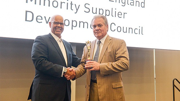(left) Peter Hurst, President & CEO of the GNEMSDC, presents Richard Witcher, co-owner of Minuteman Trucks, Inc. with the Shining Star Award. Witcher accepted the award on behalf of his brother, William. They are equal owners of the company. Minuteman was recognized for its longstanding support of the GNEMSDC and its initiatives.