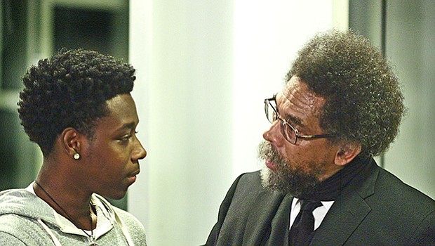 Dr. Cornel West takes a moment with a young audience member, Jeysaun Gant, to answer his question with a thoughtful, direct comment.