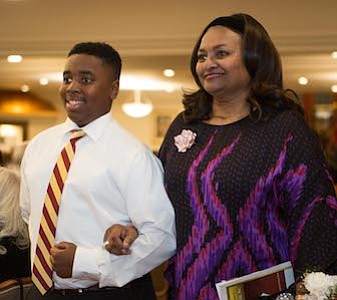 Kappa League Member of Burlington-Camden (NJ) Alumni Chapter of Kappa Alpha Psi Fraternity, Inc , Jaden McSeed escorted honoree Dr. Edith "Edie" M. Simpson to her seat.