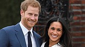 Britain’s Prince Harry poses with his fiancée, U.S. actress Meghan Markle, at the Sunken Garden at Kensington Palace in London following Monday’s formal announcement of their engagement.