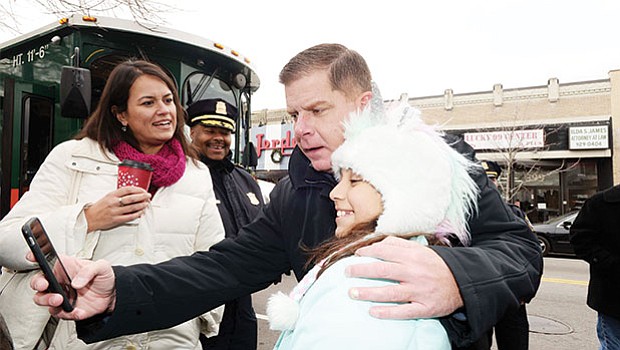 Mayor Martin Walsh meets and greets residents and leads the countdown to light the Christmas tree in Codman Square, Dorchester during the Mayor’s Trolley tour through the neighborhoods of Boston.