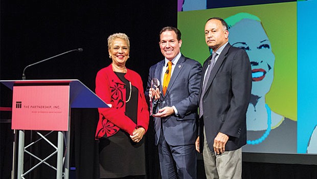 The Partnership’s 30th Annual Meeting that took place last week. Presenting Eastern Bank Chairman and CEO Bob Rivers (center) with an award are Partnership founder Bennie Wiley and Northeastern University Senior Vice Counsel Ralph Martin.