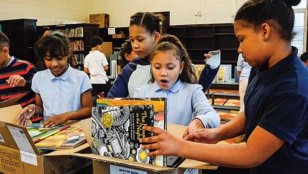 Students (grades 3 and 5), teachers and administrators from Jamaica Plain’s Curley K-8 School receive books and funds from The Boston Book Festival’s “Shelf Help” efforts. Through its “Shelf Help” initiative, Boston Book Festival donated 60 new childrens books and over $5,000 to Jamaica Plain’s Curley K-8 School library, which is set to re-open in 2018.