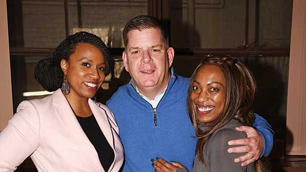 At-large City Councilor Ayanna Pressley, Mayor Martin Walsh and Dacia Tamara Shillingford-Compas took a break at the Mattapan Food Pantry during the annual holiday food basket giveaway.