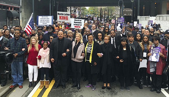 Relatives of the Rev. Martin Luther King Jr. led more than 1,000 people on a march Monday in downtown Atlanta, ... Relatives of the Rev. Martin Luther King Jr. led more than 1,000 people on a march Monday in downtown Atlanta, ...
