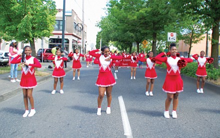 King Middle School Lions Drill Team marches down Northeast Martin Luther King Jr. Blvd for the annual Juneteenth celebration.