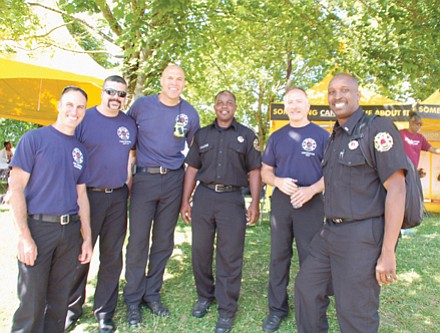Local firefighters Brent Sheldon (from left), Eric Mann, Damon Simmons, Sultan Shabazz, Pete Straub, and Ted Mayes, enjoy the festivities.