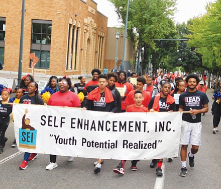 Educational non-profit Self-Enhancement Inc. marches down Martin Luther King Blvd. for the annual Good in the Hood Festival parade.