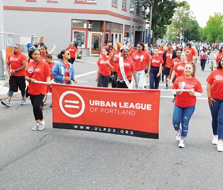 A large group represents the Urban League of Portland at Saturday’s parade.