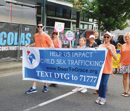 Non-profit Door-To-Grace, an organization helping to cease child sex trafficking, shows out for the parade.