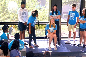 TeenAge Communication Theatre group performs a skit on domestic violence.