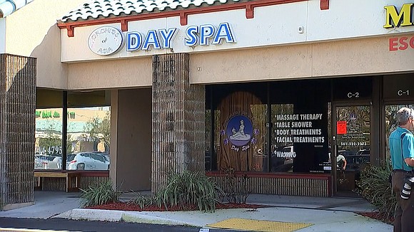Neighbor: Men frequented massage parlor raided by feds