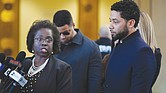 Jussie Smollett, right, stands beside his attorney, Patricia Brown Holmes, at a press conference in Chicago after prosecutors on Tuesday dropped felony charges accusing him of faking a racist, anti-gay attack on himself. The “Empire” star agreed to do community service and let the city keep his $10,000 bail exchange for the deal.