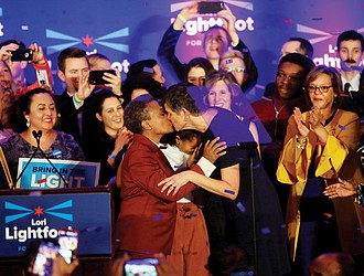 Chicago Mayor-elect Lori Lightfoot, left, kisses her wife, Amy Eshlemen, during her victory celebration Tuesday night after defeating challenger Toni Preckwinkle to become the first African-American woman and openly gay mayor of the city.