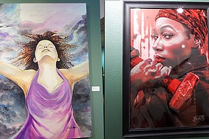 Framed art from the #MeToo Phenomenal Woman exhibit at the African American Museum.