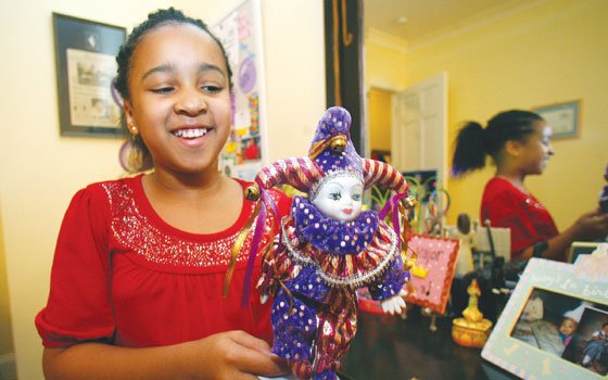 In this Dec. 2, 2009, photo, Elizabeth Dampier, 10, the voice of young Tiana, the female title character... In this Dec. 2, 2009, photo, Elizabeth Dampier, 10, the voice of young Tiana, the female title character...