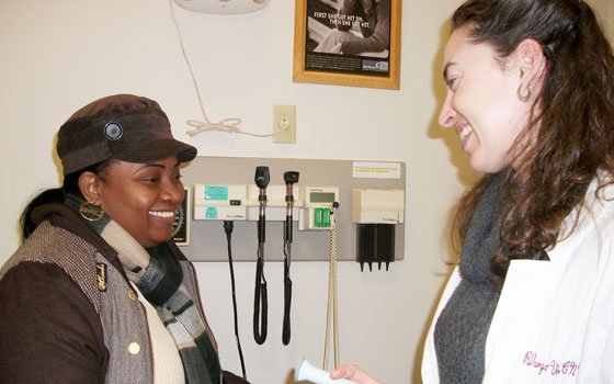 Midwife Raquel Vargas-Vila sees patient Copin Jouselyne at the Mattapan Community Health Center. (Photo courtesy of Partners HealthCare)... Midwife Raquel Vargas-Vila sees patient Copin Jouselyne at the Mattapan Community Health Center. (Photo courtesy of Partners HealthCare)...