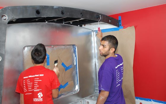 Students from Northeastern University paint as part of the renovations to Putnam Place on Glendale Street in Dorchester.... Students from Northeastern University paint as part of the renovations to Putnam Place on Glendale Street in Dorchester....