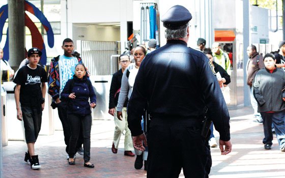 “No mutual respect” between MBTA police and youths; vow to offer solutionAn MBTA police officer watches as... “No mutual respect” between MBTA police and youths; vow to offer solutionAn MBTA police officer watches as...
