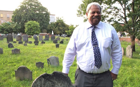Roxbury Highlands Historical Society President Thomas Plant examines colonial history in the Eliot Burying Ground. HBI,... Roxbury Highlands Historical Society President Thomas Plant examines colonial history in the Eliot Burying Ground. HBI,...