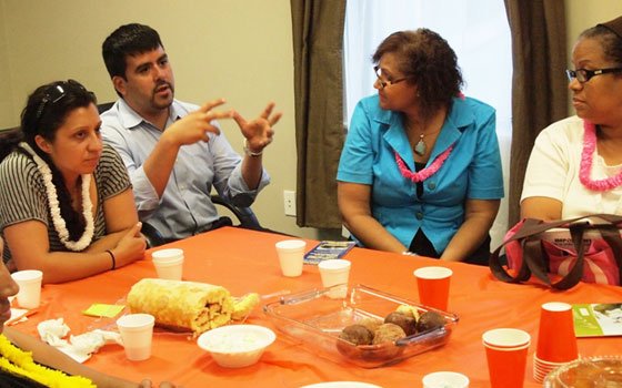 Family Independence Initiative of Boston Executive Director Jesus Gerena chats with clients of the anti-poverty program during a meeting at... Family Independence Initiative of Boston Executive Director Jesus Gerena chats with clients of the anti-poverty program during a meeting at...