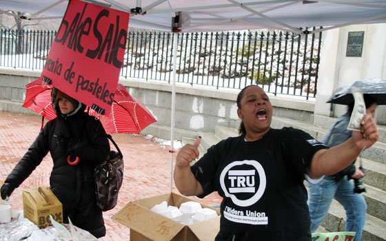 T Riders Union volunteer Taisha O’Bryant (right) hawks cookies, cakes and other sweet treats at a bake sale... T Riders Union volunteer Taisha O’Bryant (right) hawks cookies, cakes and other sweet treats at a bake sale...