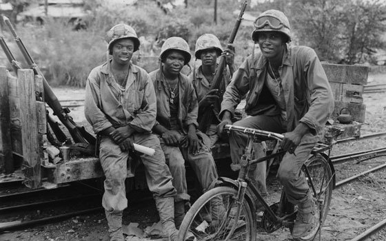 Four U.S. Marines are seen as they take a timeout from supplying ammunition to the frontlines during the... Four U.S. Marines are seen as they take a timeout from supplying ammunition to the frontlines during the...