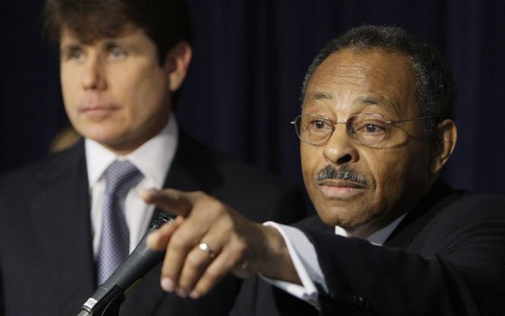 Former Illinois Attorney General Roland Burris (right) speaks as Illinois Gov. Rod Blagojevich looks on during a news... Former Illinois Attorney General Roland Burris (right) speaks as Illinois Gov. Rod Blagojevich looks on during a news...