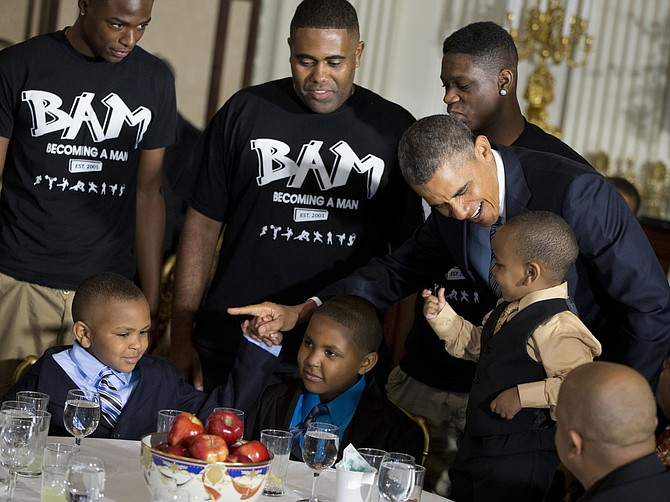 Students from Hyde Park Academy's Becoming a Man program spends Father's Day with President Barack Obama. President Obama visited the school in Feb. where the young men shared their feelings and talked about their struggles. 