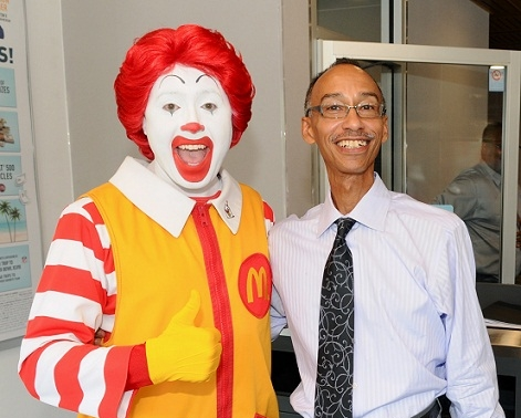 Black McDonald's Operations Association member Keith Allen and Ronald McDonald at the newly renovated McDonald's at 70 E. Garfield.