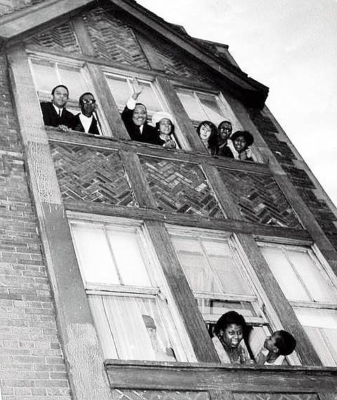 Dr. Martin Luther King Jr. and his wife Coretta Scott King, (pictured center top) wave from their second floor Chicago West Side apartment in 1966.
Photo courtesy of the Lawndale Christian Development Corporation.