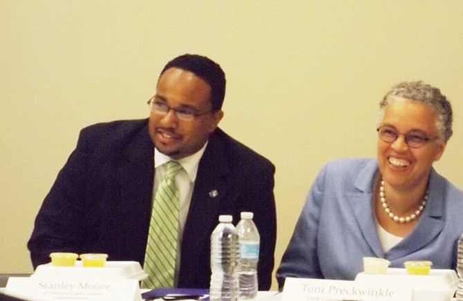 Pictured (L-R) Stanley Moore, 4th District Cook County Commissioner and Cook County Board President, Toni Preckwinkle, prepare to speak during Moore’s 4th District South Chicago Economic Development Forum held at QBG Foundation/Chatham Business Association headquarters, 806 E. 78th St., last week. 