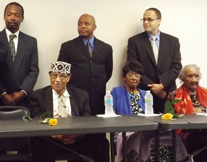  L-R back row, Community activists Otis Porter, Meldan Langford and Miguel Bonilla were on hand to serve centenarians who were honored Friday during an event held at the Wheeler House Senior Apartments, 1450 W. 69th St. Pictured front row L-R Community Activist Webb Evans, who turns 100 in Oct.; Aimlee Cruikshank, 109; and Aileen Reed, 103.