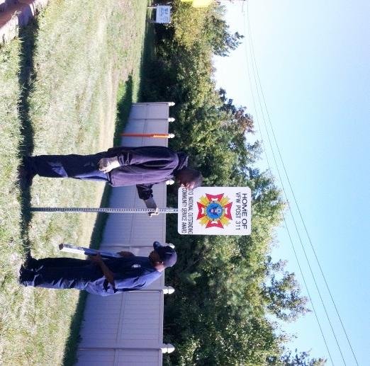 Ricky Collins and Eric Wiley Jr. of Public Works install the VFW Post 311’s community service award sign on Sauk Trail.
Photo courtesy of Larry Gobel (Director of Public Works) 